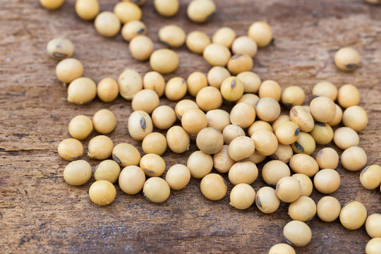 Soy Bean On The Wooden Table.