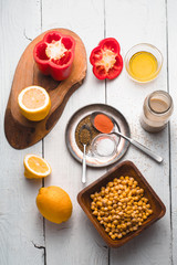 Ingredients for hummus preparation ob the white wooden table