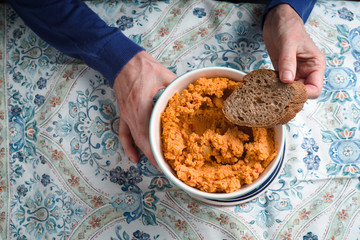 Eating hummus on the patterns background horizontal