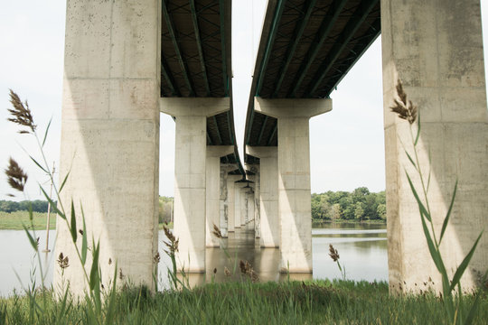 Concrete Pillars Of Bridge In River