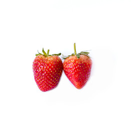Two red strawberries  on white background