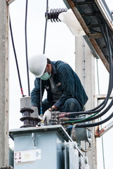 engineer electrician maintenance working on high voltage pole on