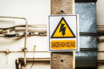 symbol danger high voltage at cement pole