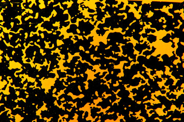 A black and yellow spotted abstract texture.