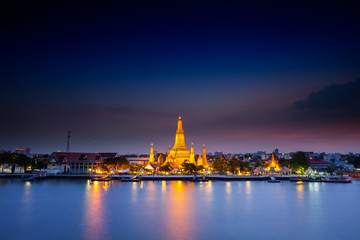 Reflection of gold pagoda "Wat Arun" temple of Bangkok at night time 