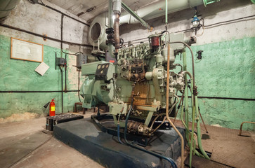 Fototapeta na wymiar Diesel generator inside an old Soviet bomb shelter