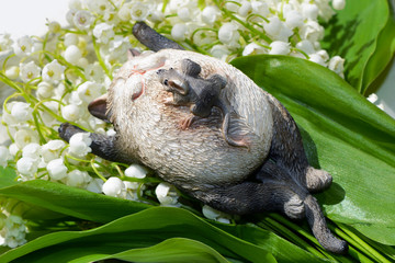 Figurine of cat with mouse.