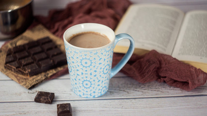 Blue Cup of hot Cocoa with pieces of chocolate