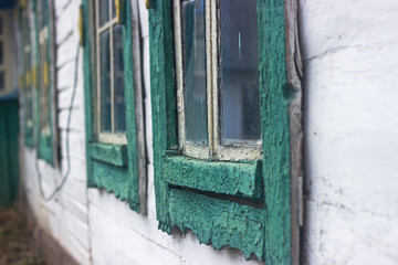 Abandoned old scaly houses near Chernobyl at spring