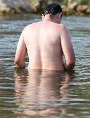 a man floating in the river