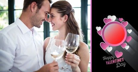 Romantic couple holding wine glass and valentine text