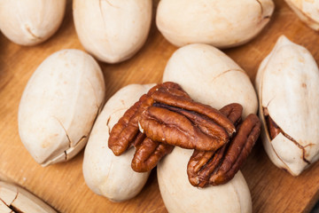 Brown pecans. Nuts. Tasty and healthy food. For your design.