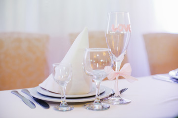 Champagne flute with pink lettering 'Love' and pink bow  stands