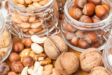 Nuts. A lot of. Close. On a wooden table. Healthy diet.