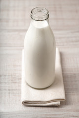 Kefir in a glass bottle on the table