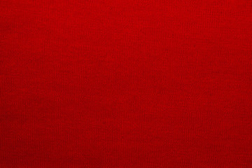 The texture of a knitted woolen fabric red