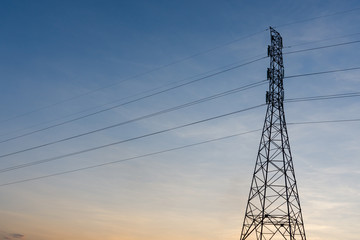 high voltage post.High-voltage tower sunset background.