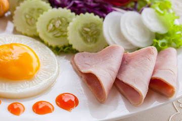 American breakfast set and orange juice on white dish