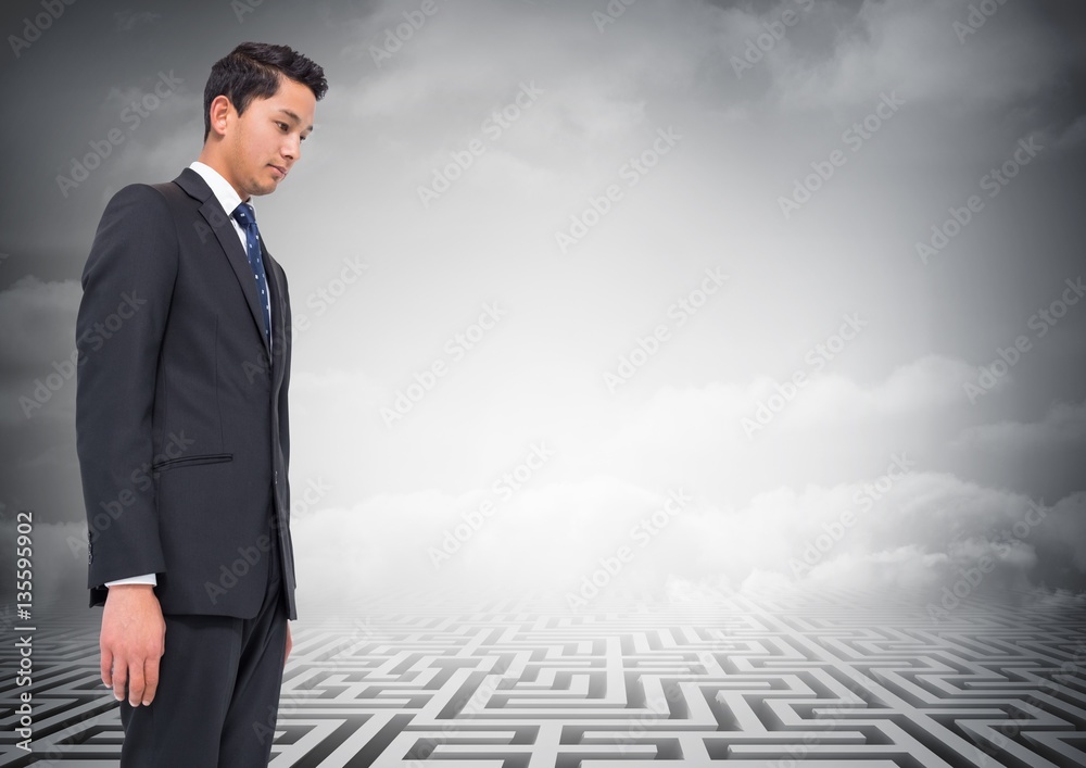 Wall mural Composite image of businessman looking at a maze