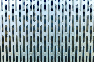 Abstract closeup of steel texture with holes
