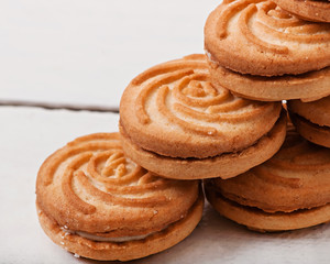 Tasty baked cookies on old wooden background.
