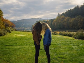 Two friends stand together  