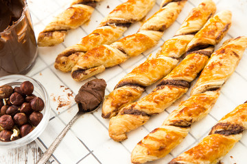 homemade cakes - puff pastry with chocolate paste. twisted cakes