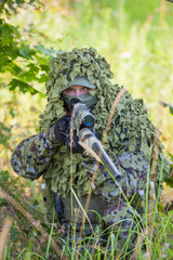 a military man in an ambush in the forest