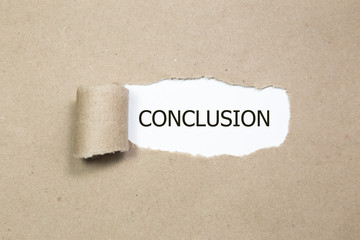 The text conclusion appearing behind torn paper