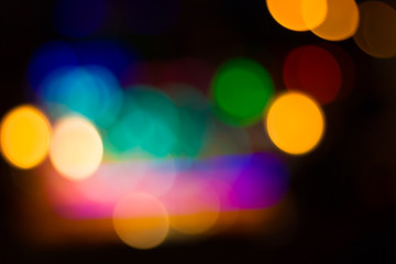 Blurred image of colorful festive lights that can be used as bac