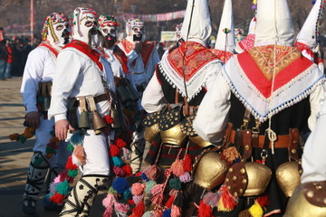 Obraz premium Pernik, Bulgaria - January 28, 2017: Masquerade festival Surva in Pernik, Bulgaria. People with mask called Kukeri dance and perform to scare the evil spirits.