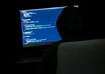 Programmer in dark room
