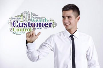 Customer - Young businessman touching word cloud