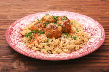Meatballs in tomato sauce with rice in a bowl