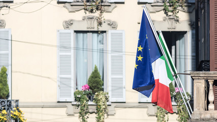 Italian and European flags in a street