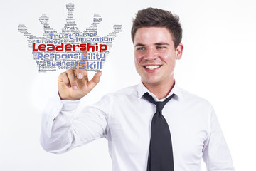 Leadership - Young businessman touching word cloud