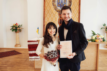 beautiful young bride and groom on the wedding ceremony
