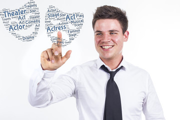 Two faces of theater - Young businessman touching word cloud