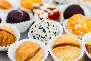 Different candies, cookies and biscuits on banquet table.