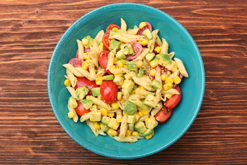 Cold pasta salad with avocado, tomato and olive oil
