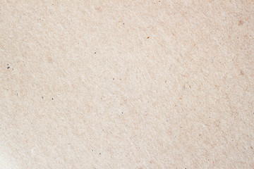 Texture of light brown paper, background for design with copy space text or image. Material is unusual and  somewhat reminiscent  a canvas, both externally  by touch.