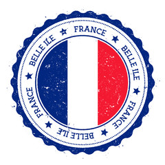 Naklejka premium Belle Ile flag badge. Vintage travel stamp with circular text, stars and island flag inside it. Vector illustration.
