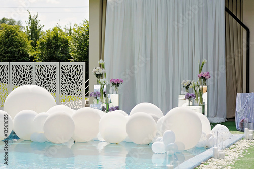 Decorations For The Wedding Ceremony By The Pool With Blue Water