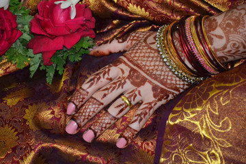 Fototapeta na wymiar Woman hands with bridal mehndi tattoo