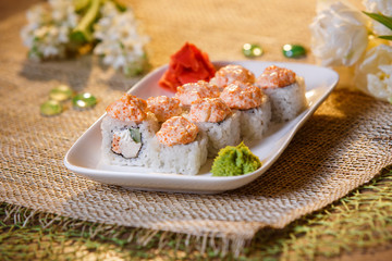 Traditional sushi rolls made of rice with caviar and sauce