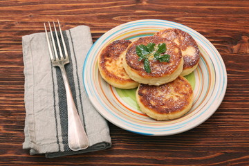 Cheese pancakes fried in a pan.