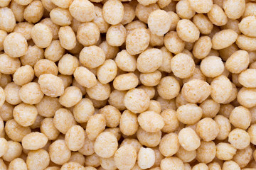 Corn flakes rings on the background.