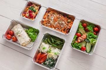 Healthy food take away, top view at wood background