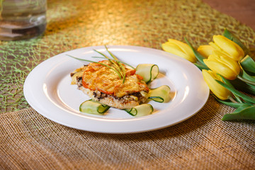 baked chicken cutlet with cheese and mushrooms