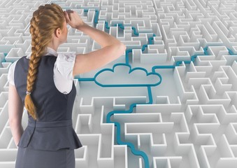 Rear view of businesswoman looking over maze